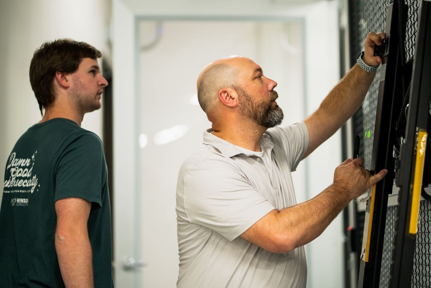 Winsor technicians installing rack equipment
