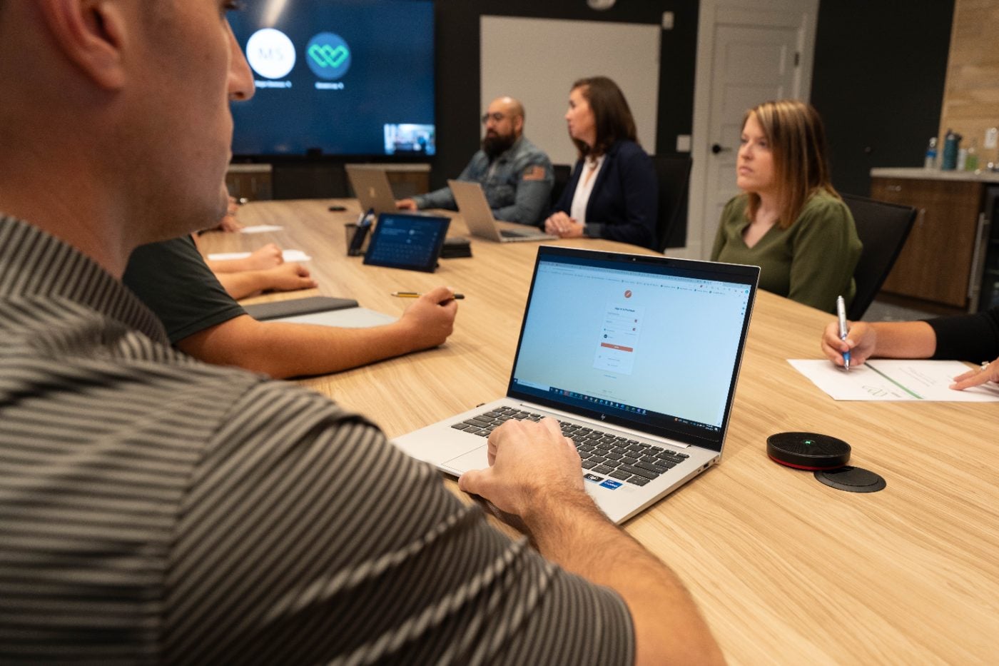 Winsor team reviewing network plans alongside a client in a conference room